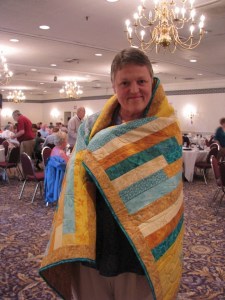 Olivia was one of the recipients who smiled all day when she received a quilt through the Parkinson's Comfort Project. Her quilt was made by Joanne Shapp.
