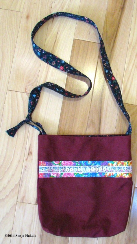 Red button bag made for the Parkinson's Comfort Project